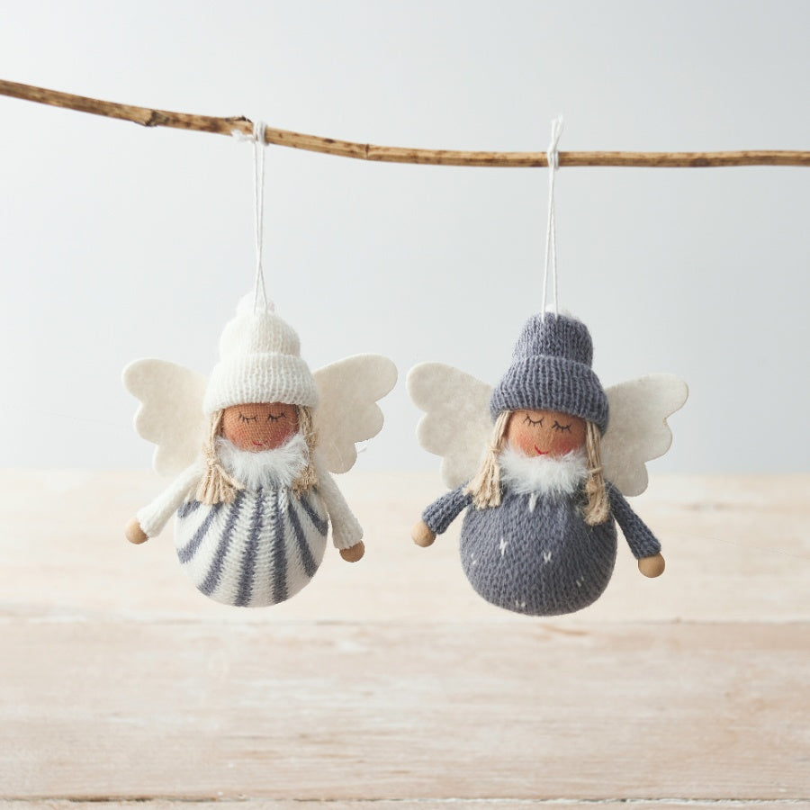 A set of two charming knitted fabric angel decorations, each with white wings and a woolly hat.