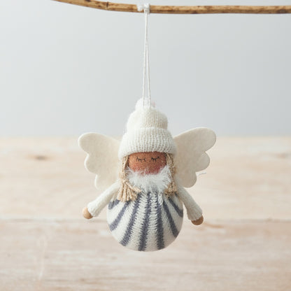 Knitted fabric angel decoration with striped body, white wings and a woolly hat.