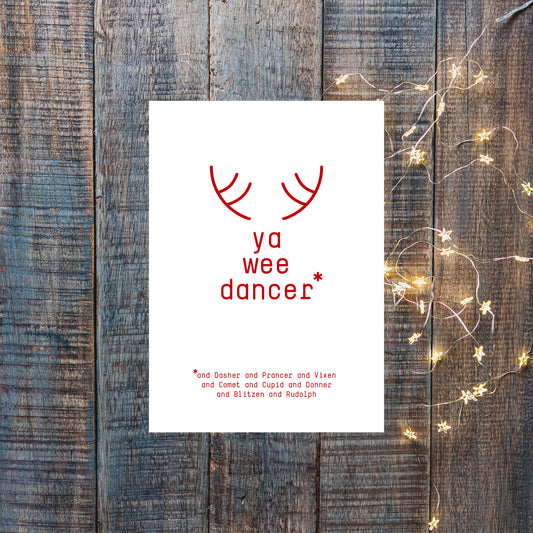 An A6 vertically folded greeting card with a Scottish Christmas phrase "Ya wee dancer" and a reindeer illustration.