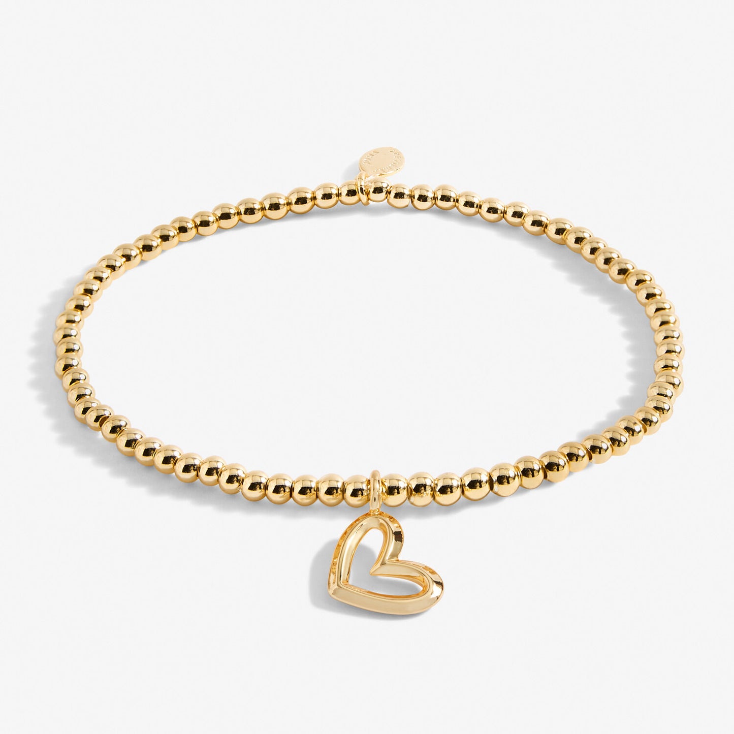 A gold plated stretch beaded bracelet with heart charm 