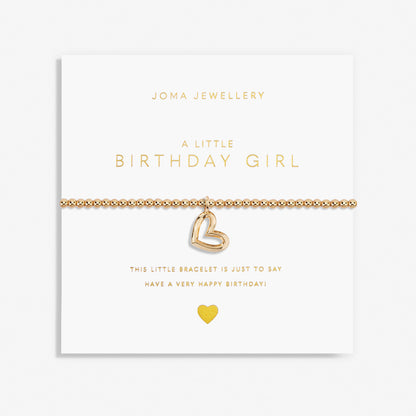 A gold plated stretch beaded bracelet with heart charm packaged with the text 'A LITTLE BIRTHDAY GIRL' 