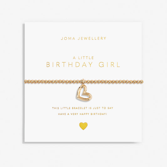 A gold plated stretch beaded bracelet with heart charm packaged with the text 'A LITTLE BIRTHDAY GIRL' 