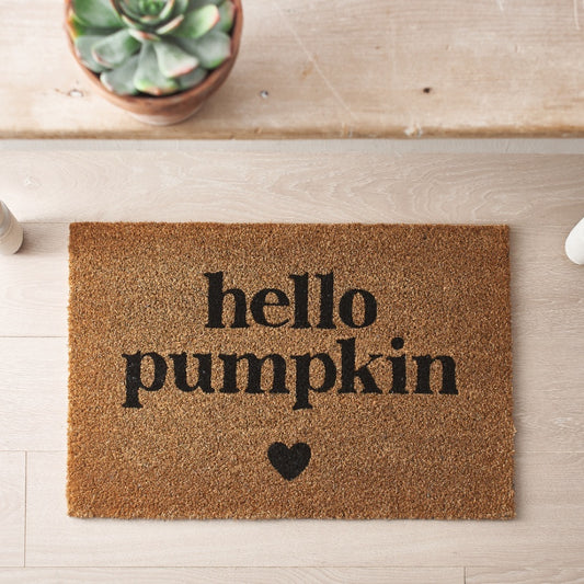 Coir doormat with Hello Pumpkin text and small heart design.