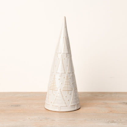 A decorative ceramic Christmas tree ornament with a simplistic shape, covered in a glossy reactive glaze and featuring embossed patterns of smaller trees and polka dots.