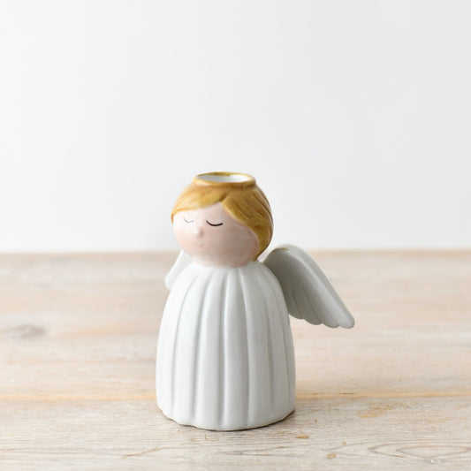 Ceramic guardian angel candlestick holder for festive décor, adding warm light and seasonal charm.