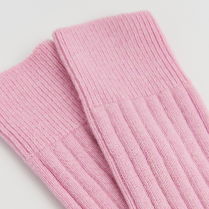 Close-up of pink ribbed knit fabric on Sugar Pink PAIRS Scotland Merino bed socks
