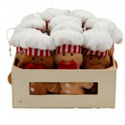 Soft fabric hanging Christmas decoration shaped like a gingerbread man baker, wearing a chef's hat and red bow, approximately 12 centimetres tall.