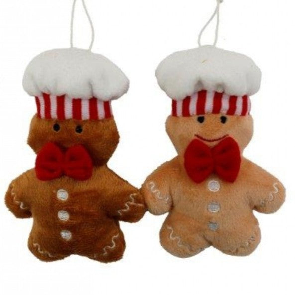 Soft fabric hanging Christmas decoration shaped like a gingerbread man baker, wearing a chef's hat and red bow, approximately 12 centimetres tall.