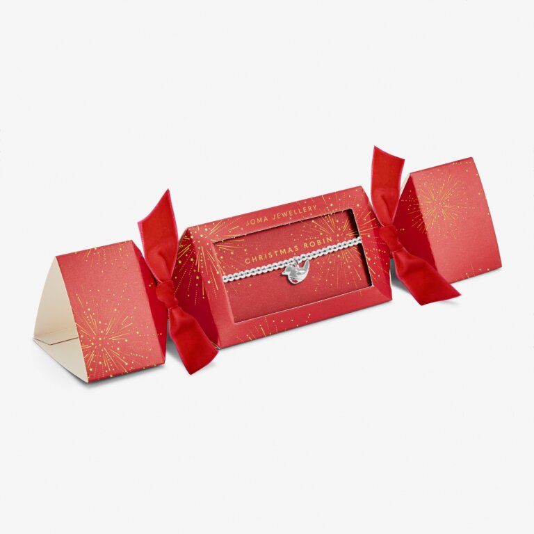 Joma silver-plated robin charm bracelet inside a red and gold cracker shaped gift box saying CHRISTMAS ROBIN