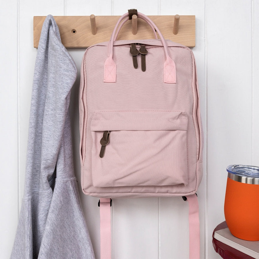 Stylish daily rucksacks with roomy main compartment and double zip, available in Red, Pink, or Blue.
