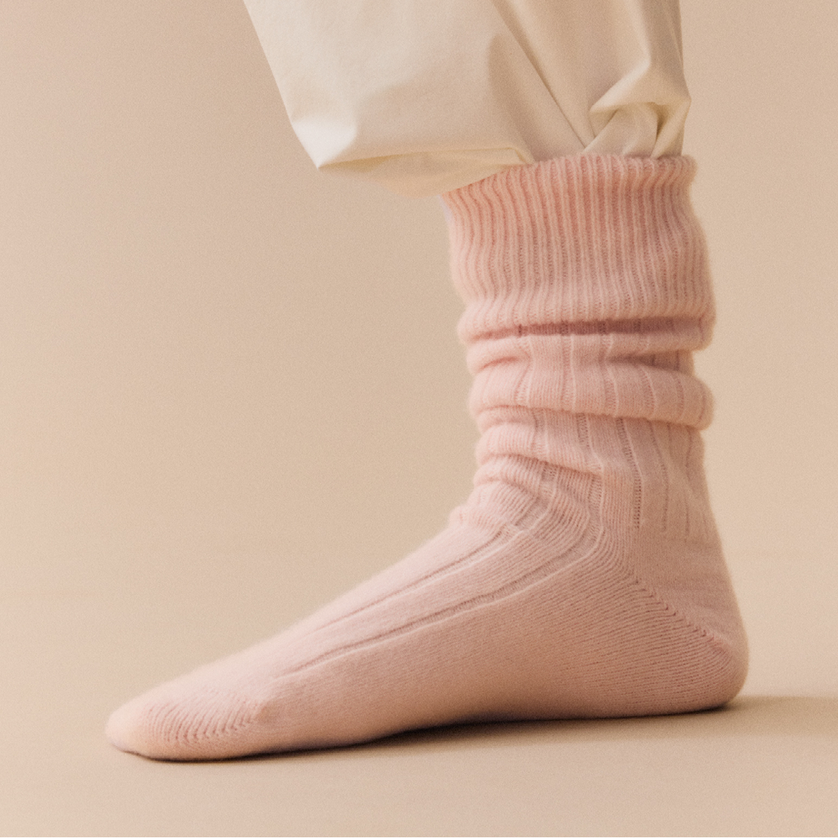 Frosting Pink PAIRS Scotland Merino bed sock shown on a single foot