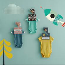 Wardrobe dividers featuring bright, fun Cosatto patterns like foxes, dinosaurs, and aliens, labelled with baby sizes.