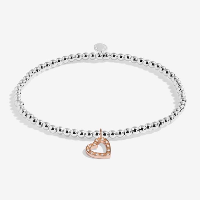 Silver plated stretch beaded bracelet with rose gold and sparkle heart shaped charm