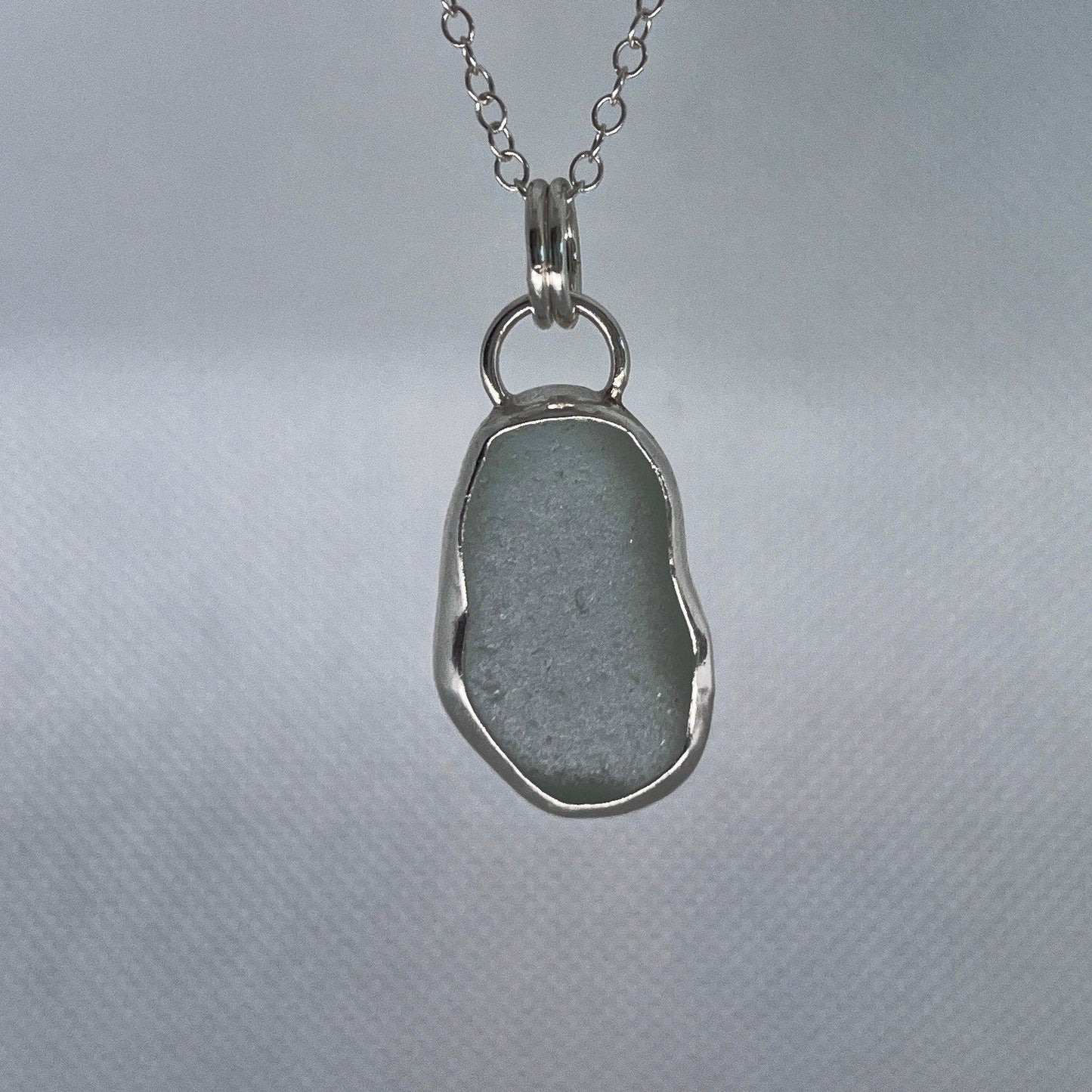 Sterling silver and aqua sea glass pendant necklace handmade in Dundee with oval shape design