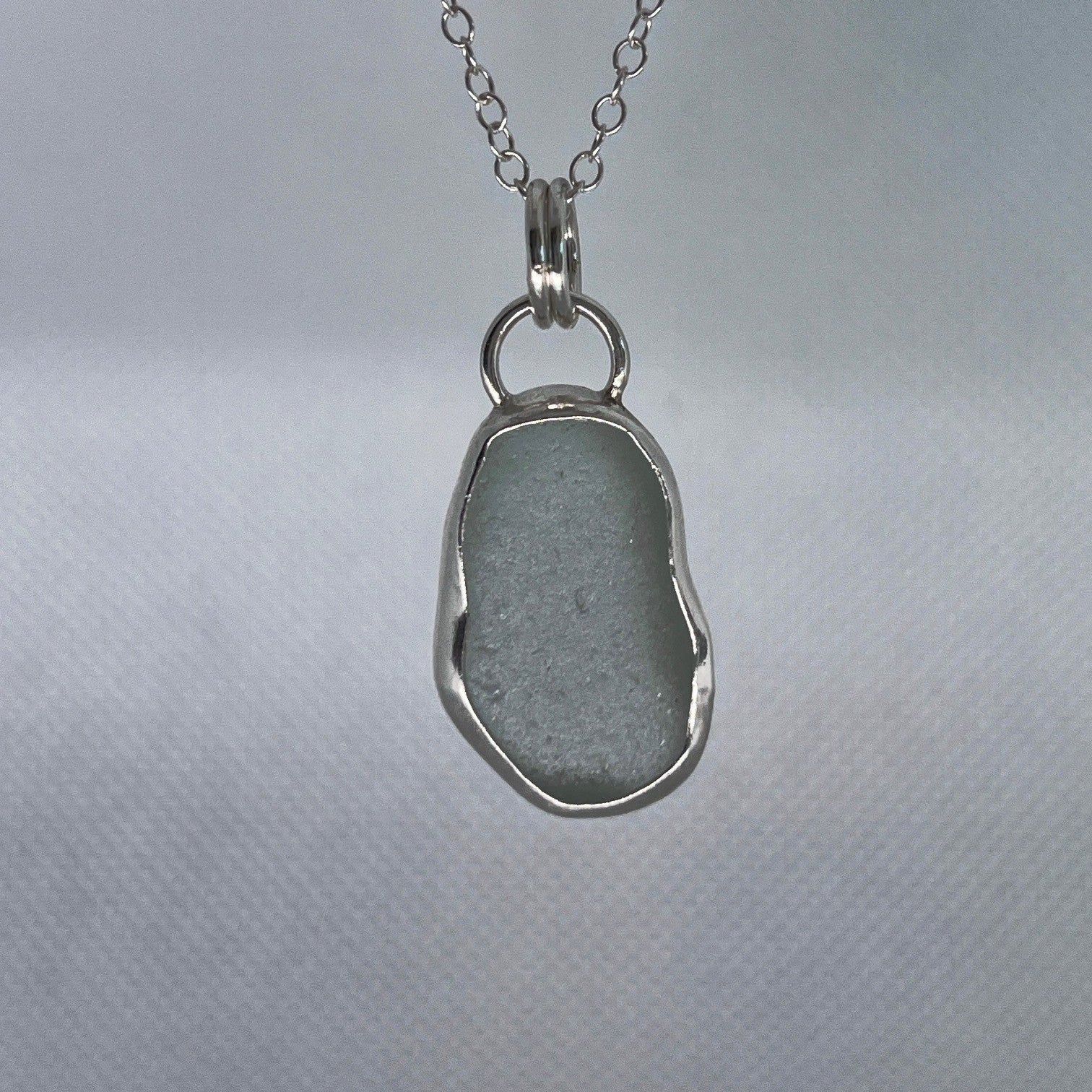 Sterling silver and aqua sea glass pendant necklace handmade in Dundee with oval shape design