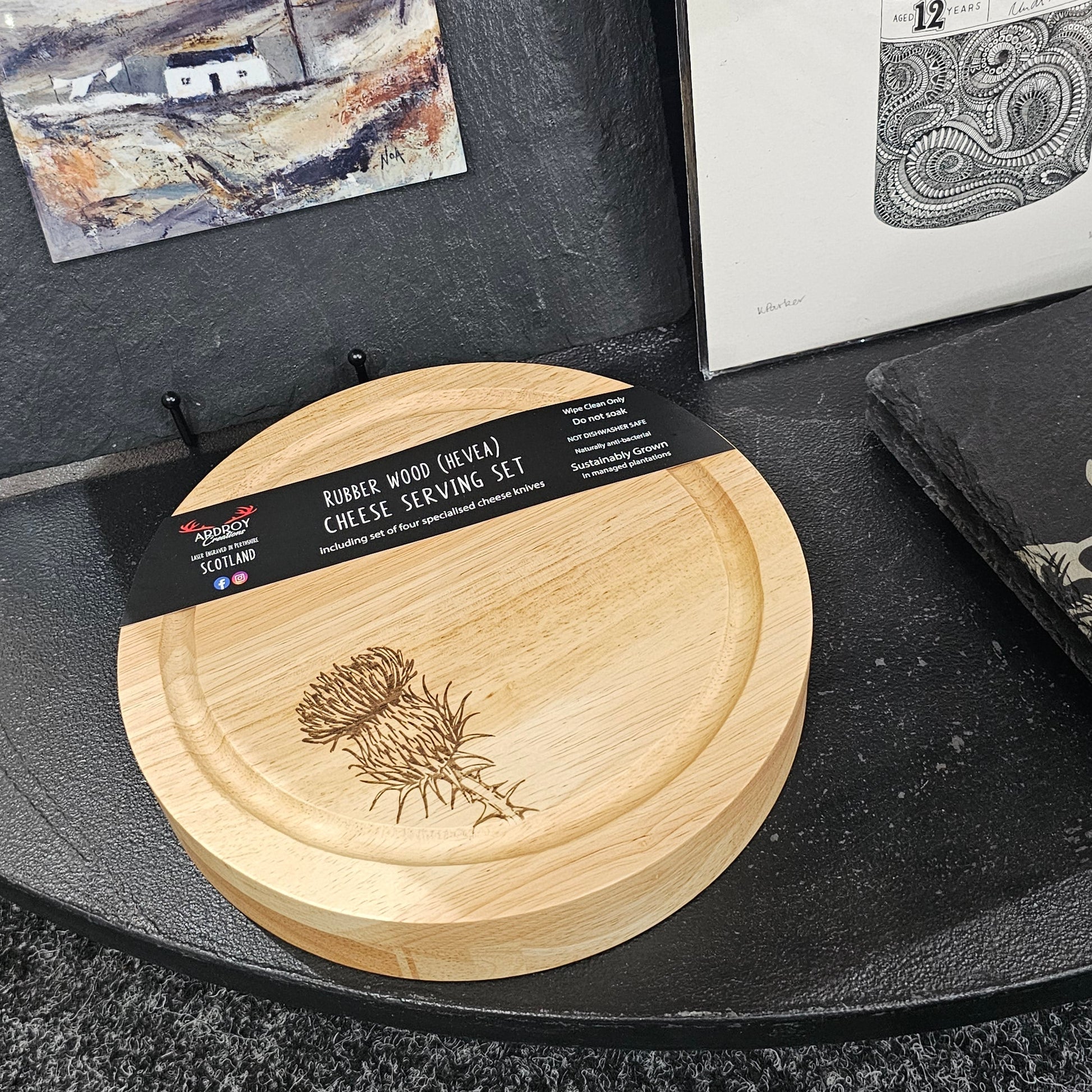 Round Hevea wood cheese serving set by Ardroy Creations with swivel opening and four specialised cheese knives