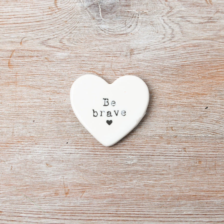 White Heart-shaped ceramic token with 'Be brave' text