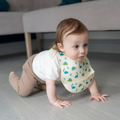 Catch It silicone baby bib by Ziggle with food pocket BPA free available in Dinosaur design