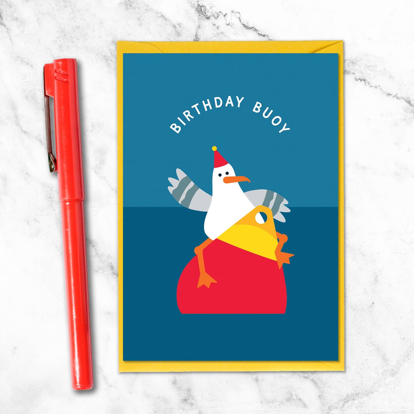 Birthday Buoy greeting card by Stoats & Weasels featuring a seagull wearing a party hat on a buoy