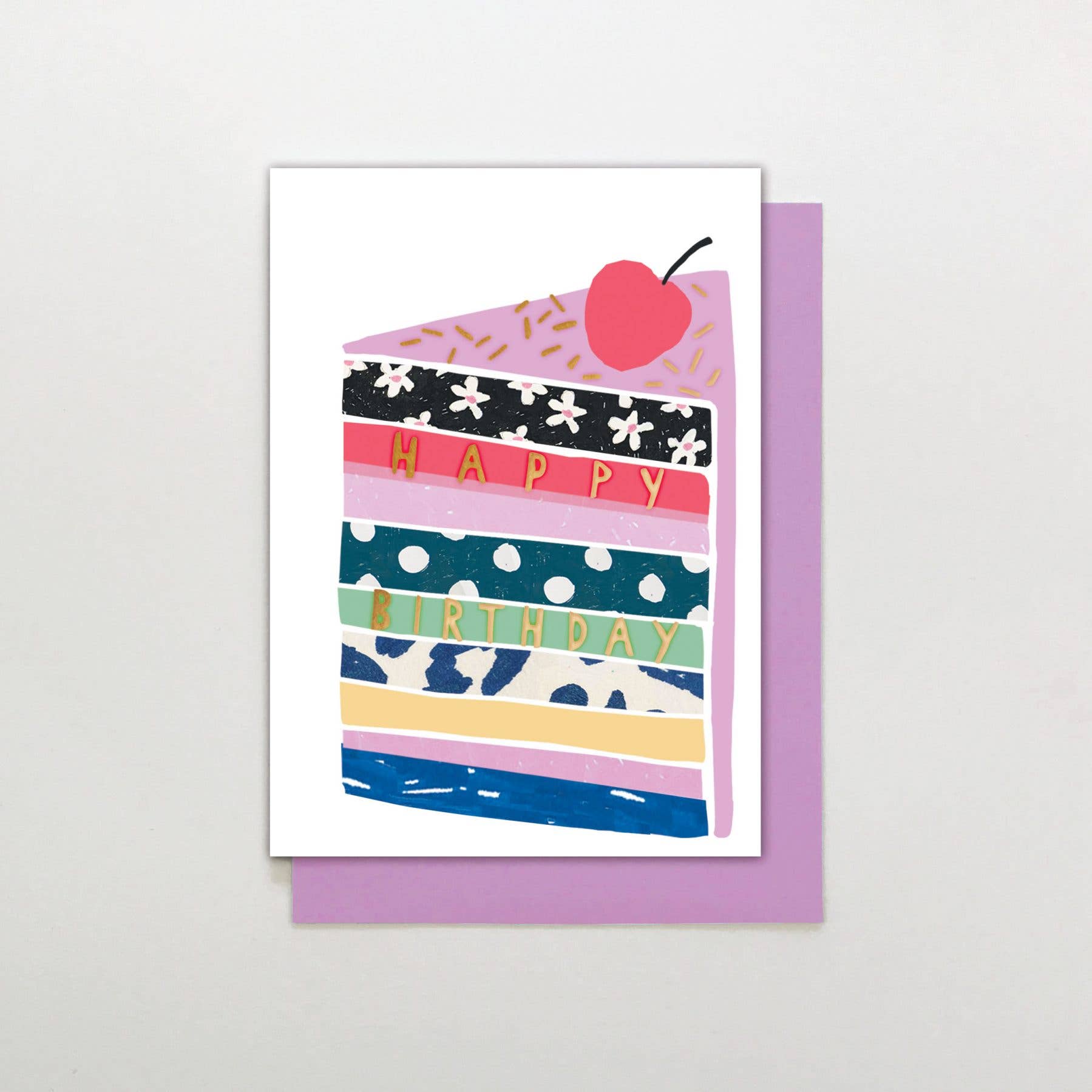 Happy Birthday greeting card with layered cake illustration and raised gold foil detail on luxury card