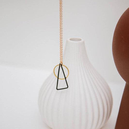 Copper Bee Black + Brass necklace with oxidised black triangle and open gold-plated circle pendant