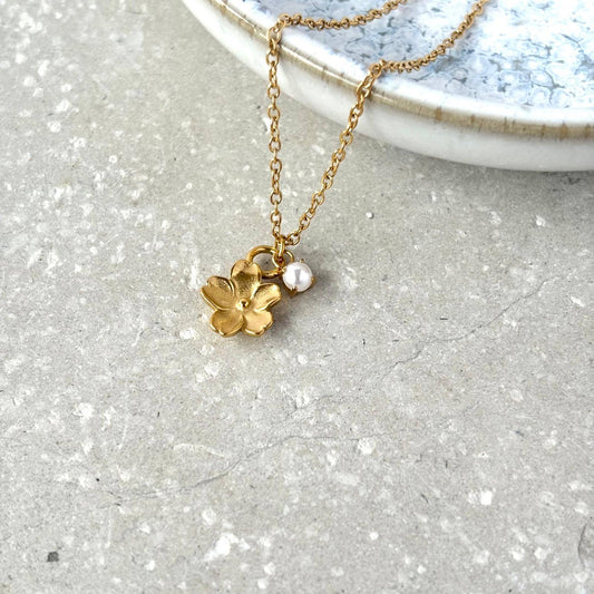 Flax Barn Blossom Flower Necklace with delicate pearl detail, crafted from tarnish-resistant PVD-plated stainless steel.