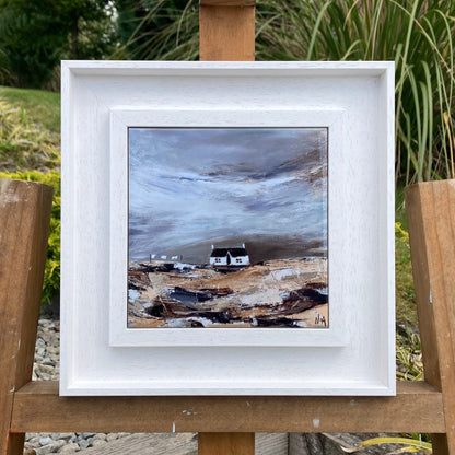 A ceramic tile print of a colourful painting titled 'Blustery Days', showing a small house nestled in the Scottish Highlands, available mounted on natural slate or framed.