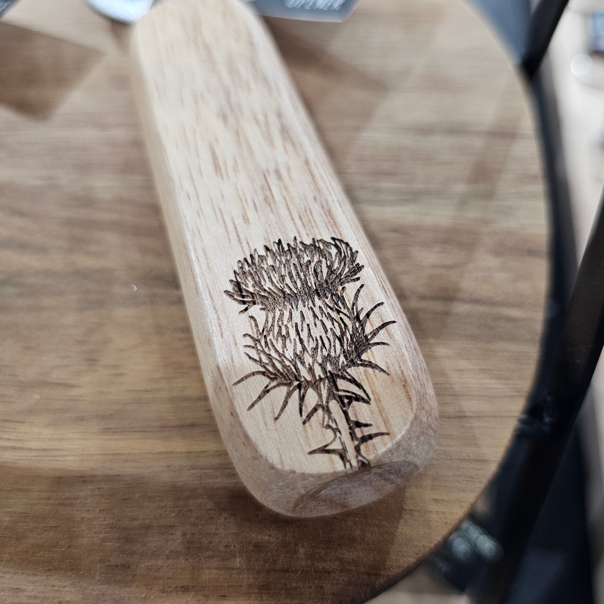 Scottish wooden bottle opener by Ardroy Creations with stainless steel hardware and Thistle design