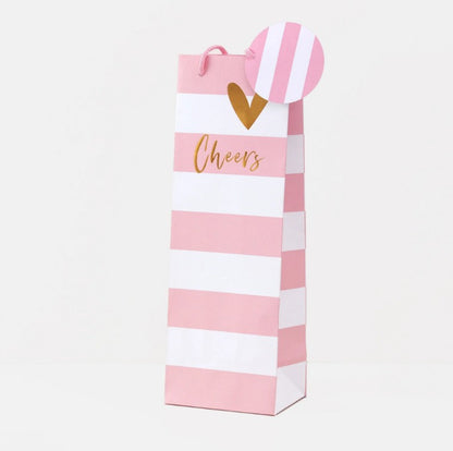 Pink and white striped Belly Button bottle gift bag with rope handles, tag and 'Cheers' gold text and heart