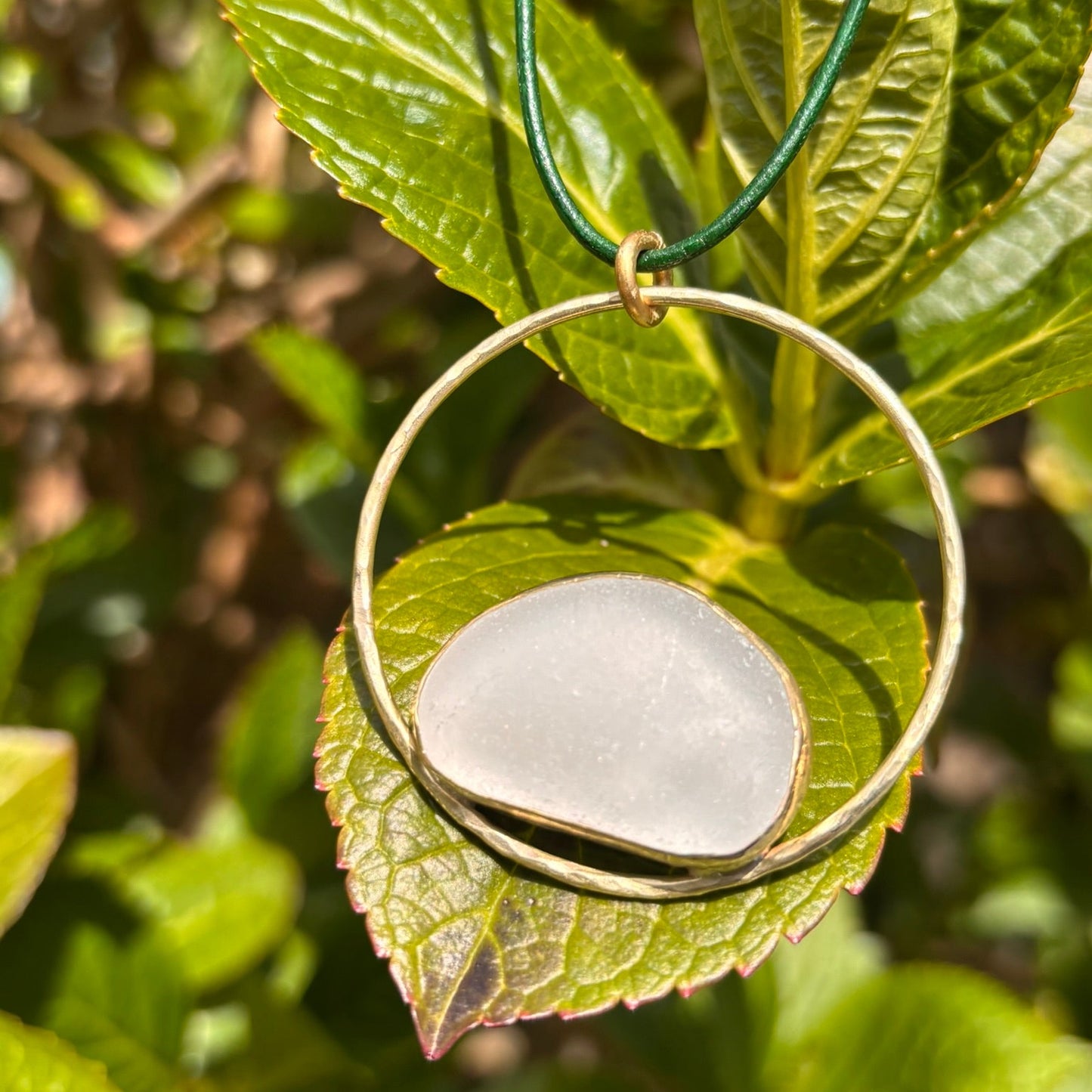 Rowan Berry Jewellery copper or brass hoop necklace with bezel set Carnoustie sea glass on an adjustable leather cord