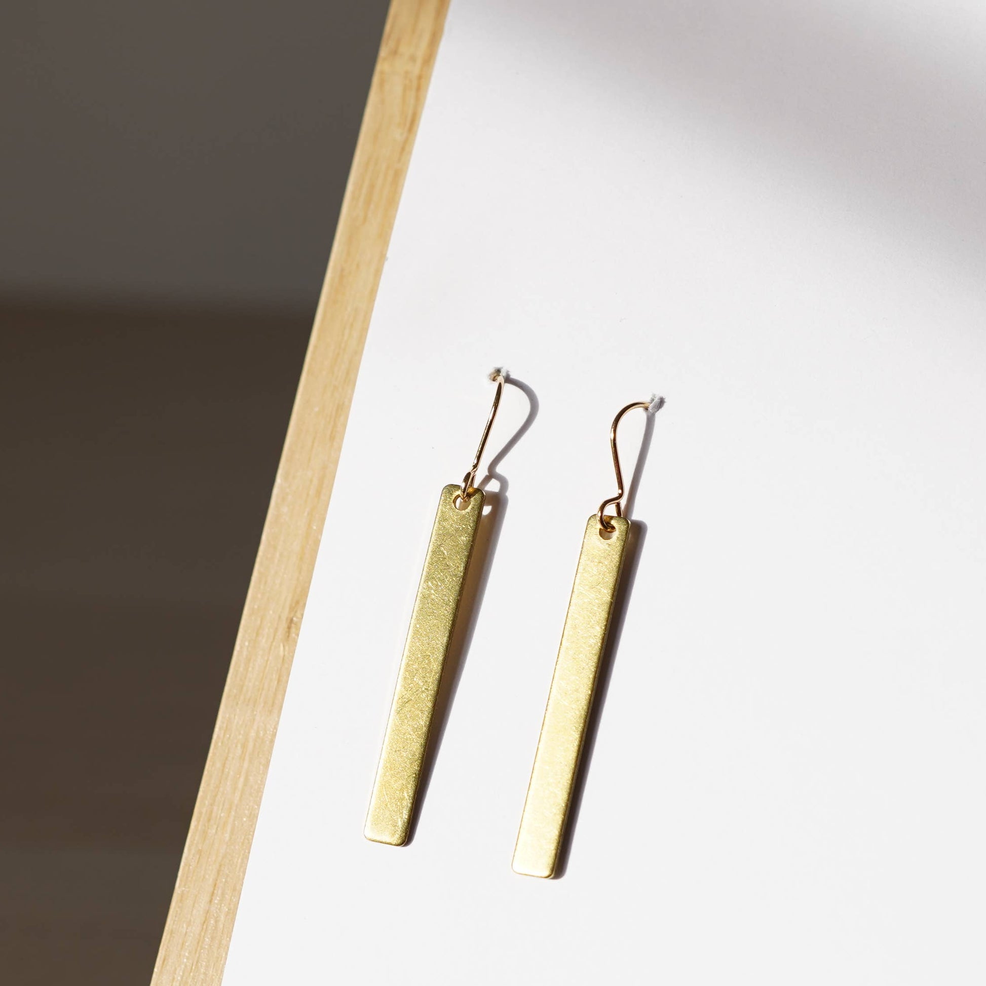 Copper Bee Simplicity Collection slim polished brass rectangle earrings with gold-plated nickel-free hooks