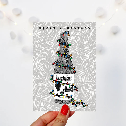 Buckfast Christmas card featuring hand-drawn bottle design by Kilo Papa Studio, printed on recycled paper with Kraft envelope.