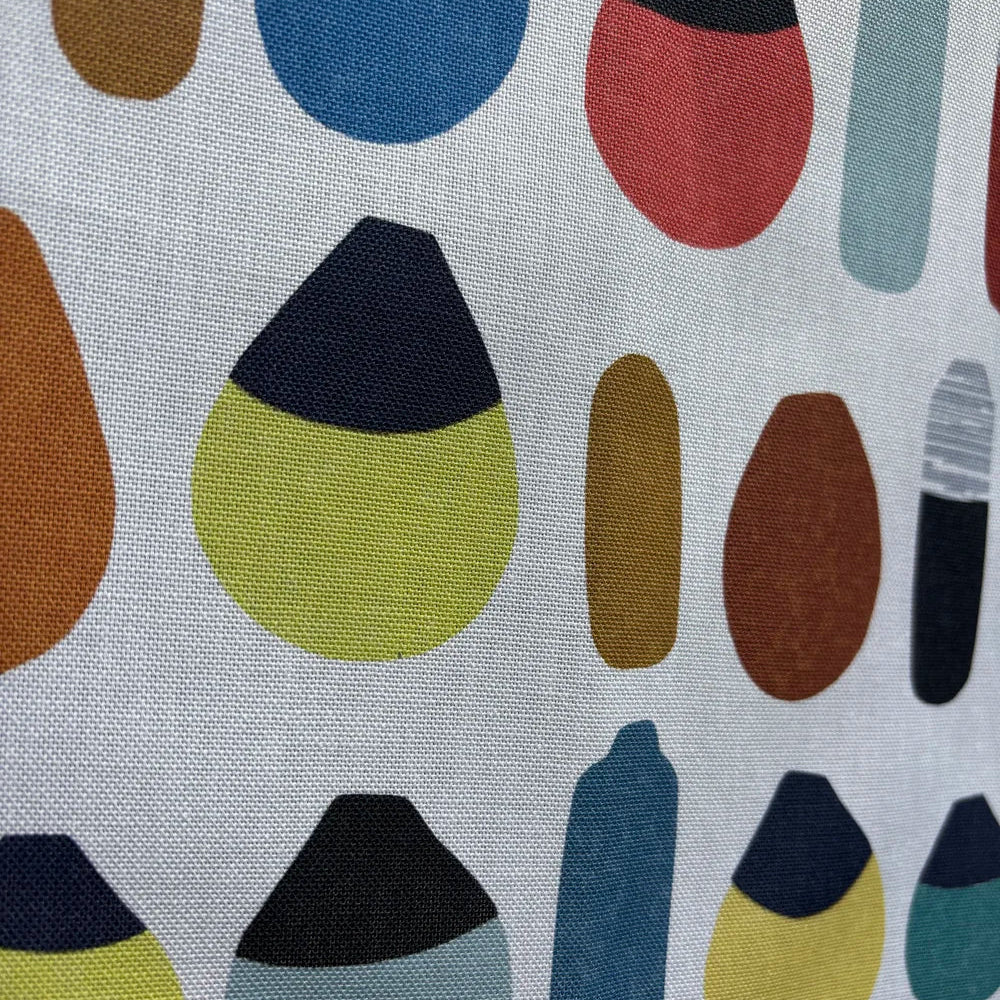 Caitlin Sparks Textiles organic cotton tea towel featuring a colourful coastal buoy pattern