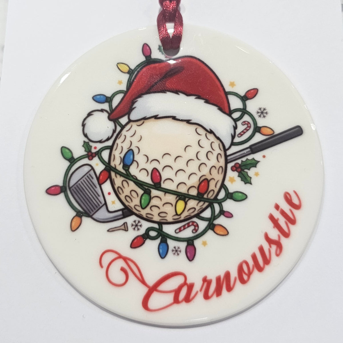 Ardroy Creations round ceramic Christmas baubles in Carnoustie Golf, Highland Cow and Dachschund designs, each 7cm in diameter with festive ribbon and presentation card.