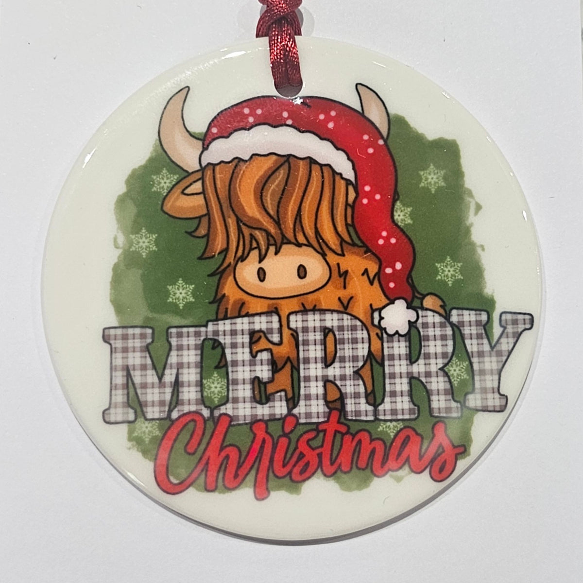 Ardroy Creations round ceramic Christmas baubles in Carnoustie Golf, Highland Cow and Dachschund designs, each 7cm in diameter with festive ribbon and presentation card.