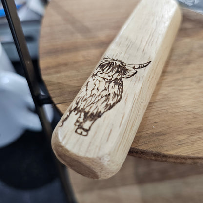 Scottish wooden handle cheese knife by Ardroy Creations with stainless steel blade in Highland Coo design