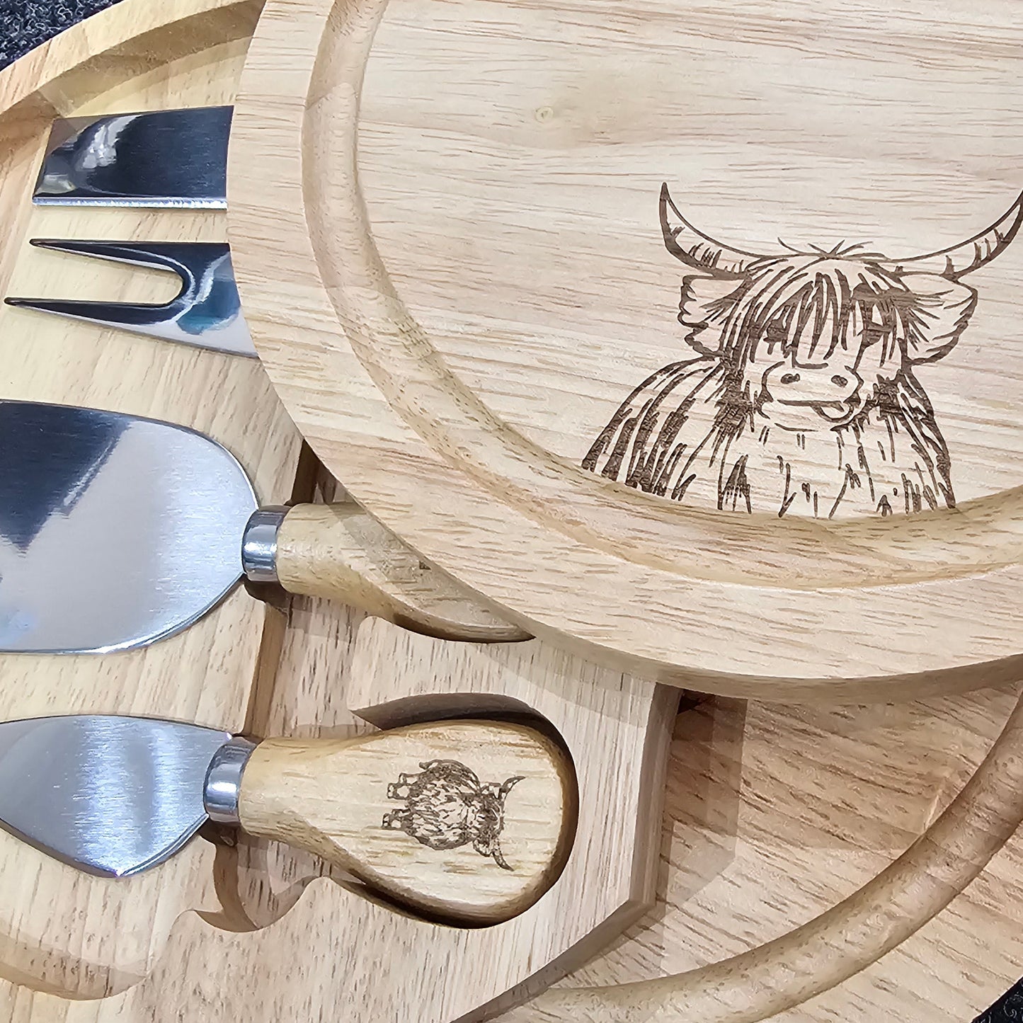 Round Hevea wood cheese serving set by Ardroy Creations with swivel opening and four specialised cheese knives