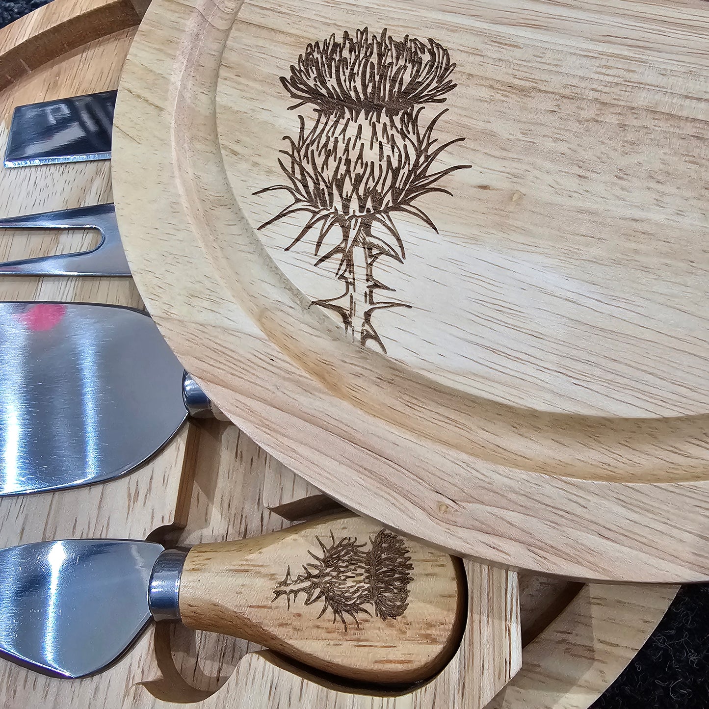Round Hevea wood cheese serving set by Ardroy Creations with swivel opening and four specialised cheese knives