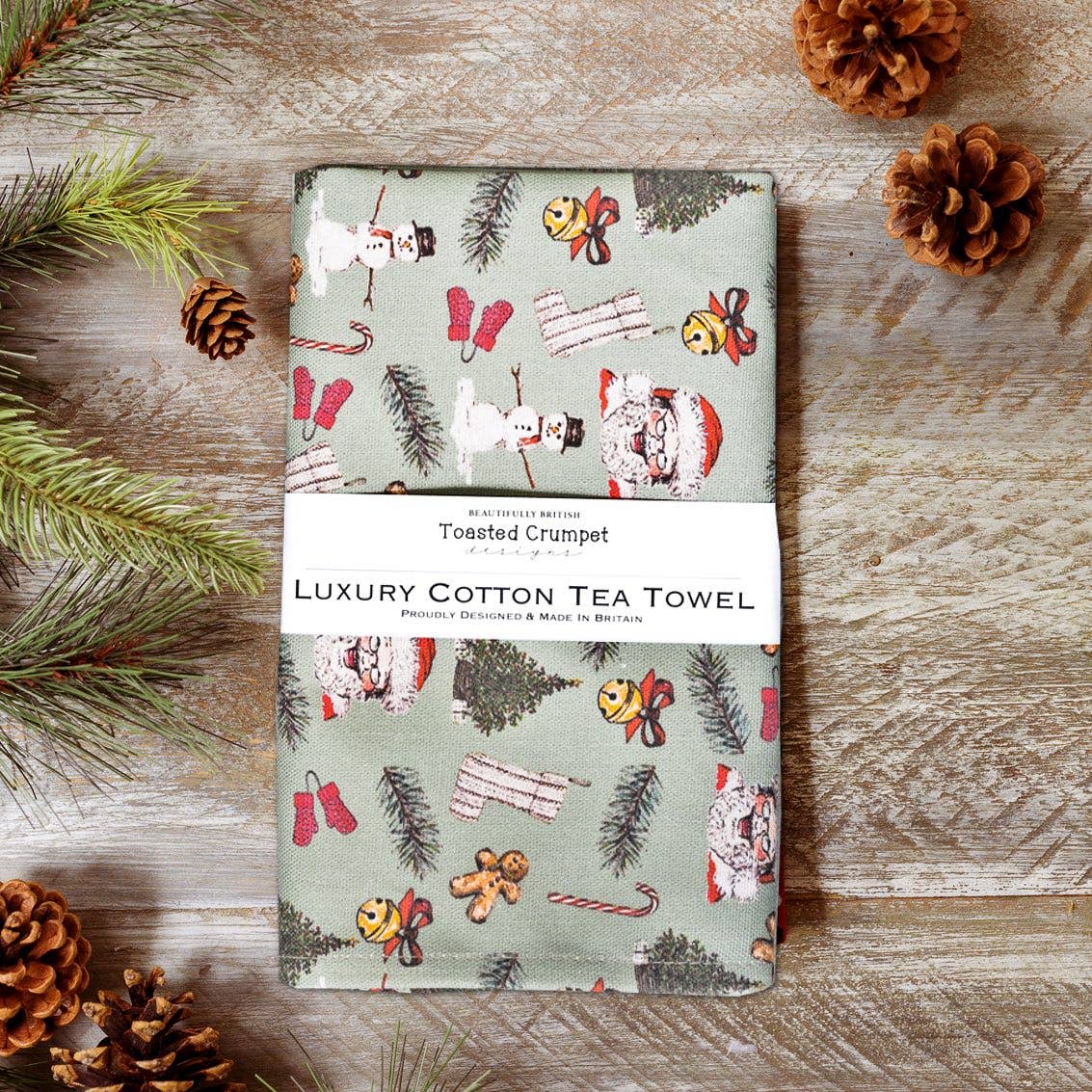 All Things Jolly Sage Green Christmas tea towel by Toasted Crumpet with festive countryside illustration