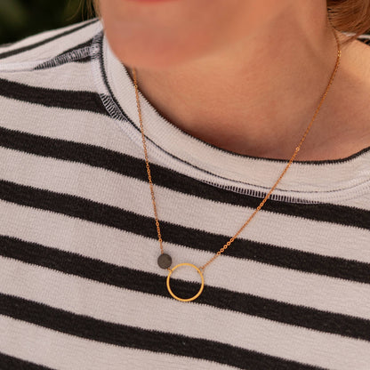 Copper Bee black and gold geometric necklace with open circle pendant and oxidised black disc