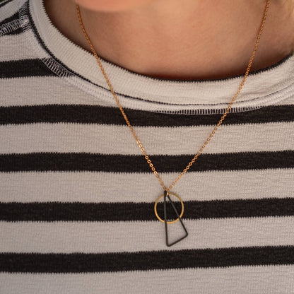 Copper Bee Black + Brass necklace with oxidised black triangle and open gold-plated circle pendant