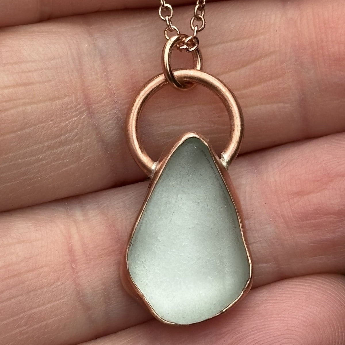 Copper bezel set white sea glass necklace by Rowan Berry Jewellery handmade in Carnoustie with locally collected sea glass