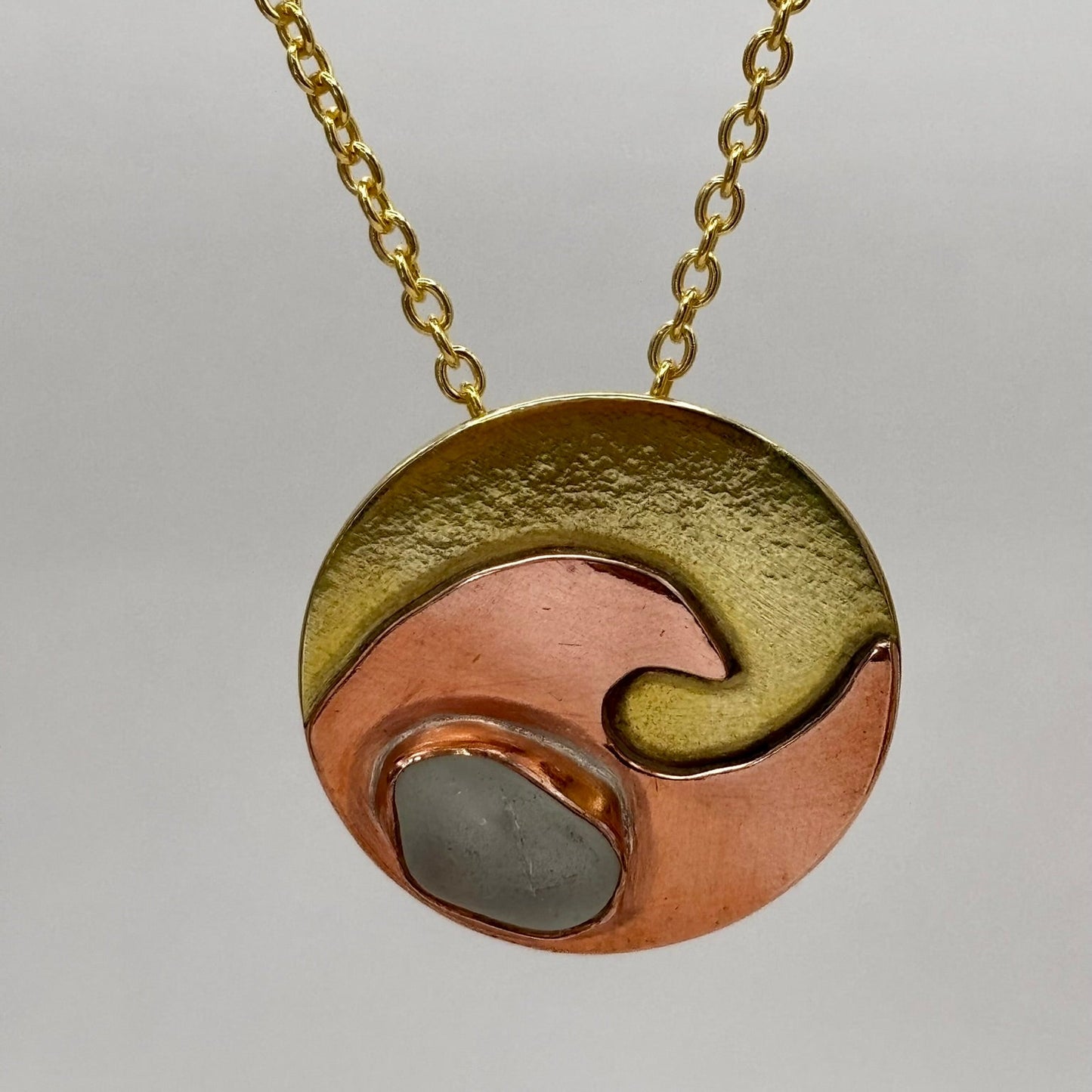 Copper wave and brass circle necklace by Rowan Berry Jewellery with genuine sea glass collected from Carnoustie beaches