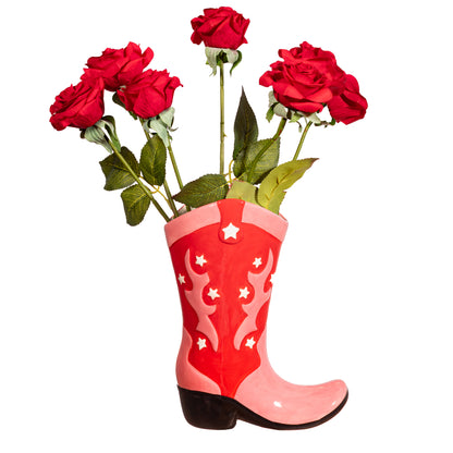 A vibrant red and pink Cowboy Boot Vase with white stars and patterns, designed to resemble a western-style boot.