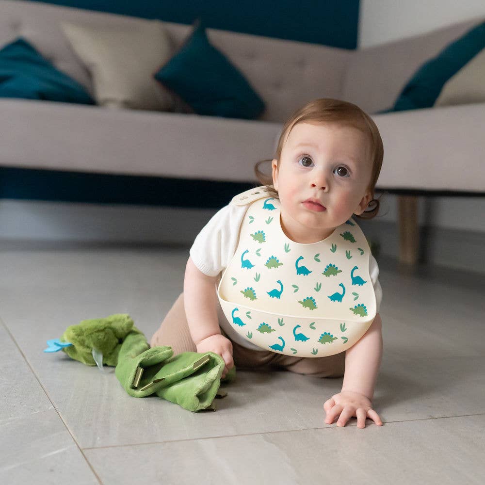 Catch It silicone baby bib by Ziggle with food pocket BPA free available in Dinosaur design