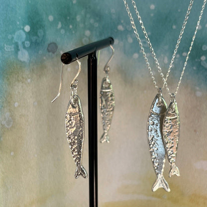 Handmade Scottish Silver Darlings pewter fish pendants and earrings inspired by historic herring and coastal heritage