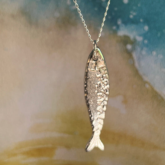 Handmade Scottish Silver Darlings pewter fish pendant inspired by historic herring and coastal heritage