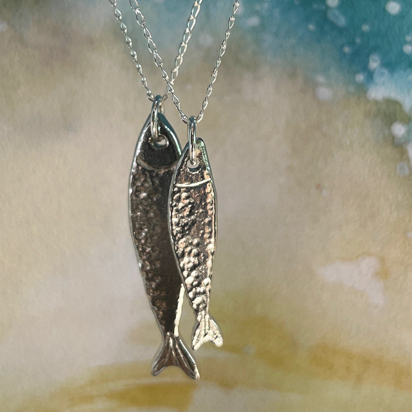 Handmade Scottish Silver Darlings pewter fish pendants inspired by historic herring and coastal heritage