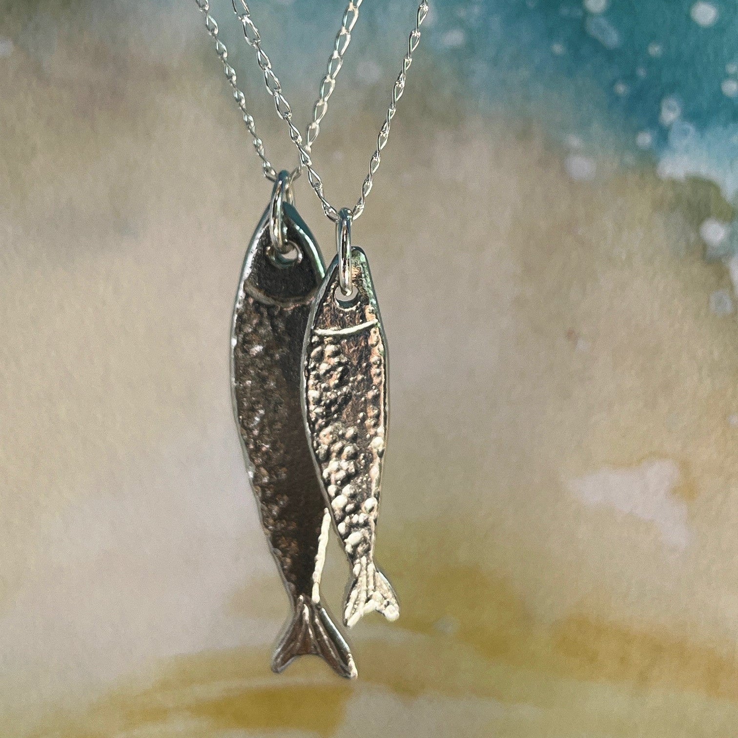 Handmade Scottish Silver Darlings pewter fish pendants inspired by historic herring and coastal heritage