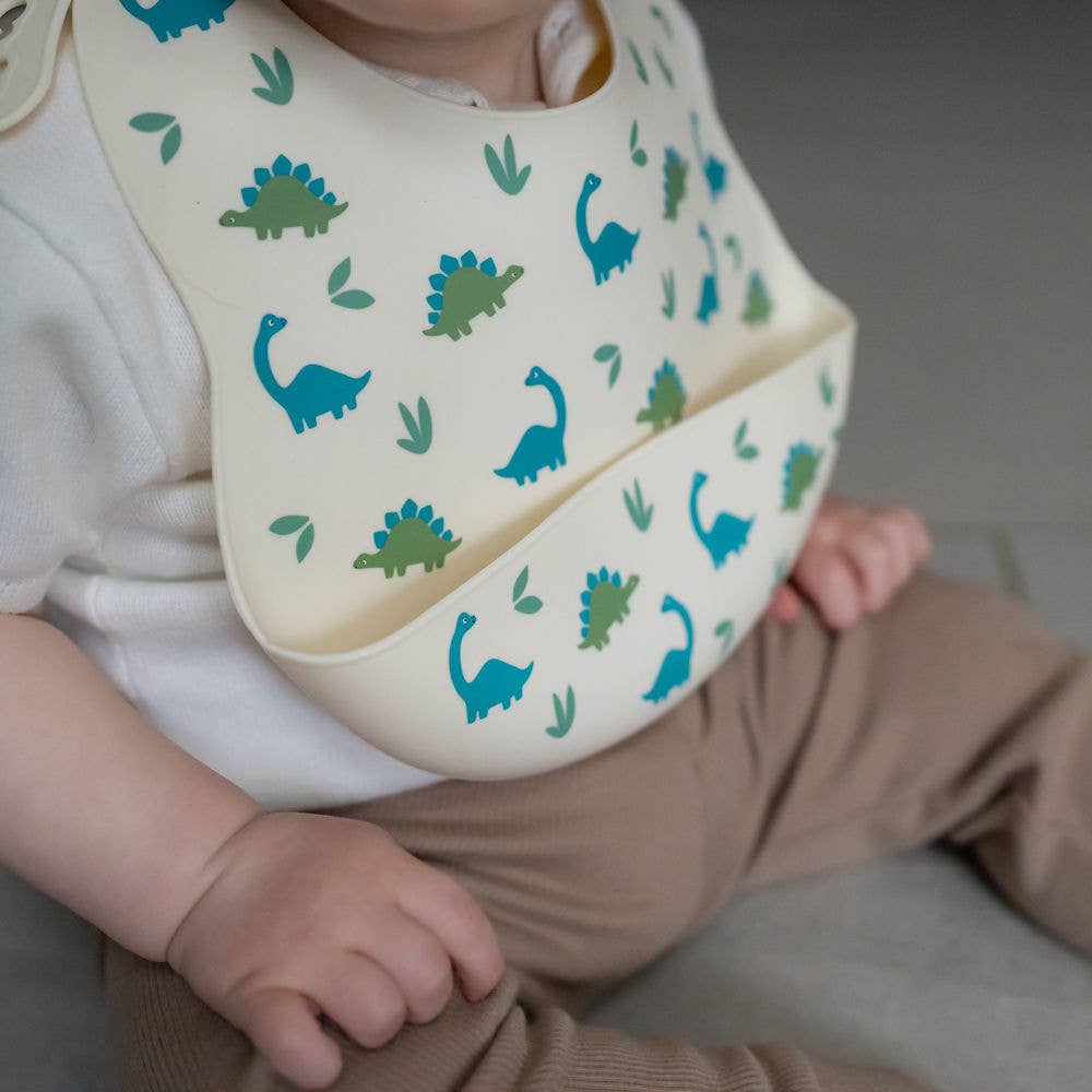 Catch It silicone baby bib by Ziggle with food pocket BPA free available in Dinosaur design